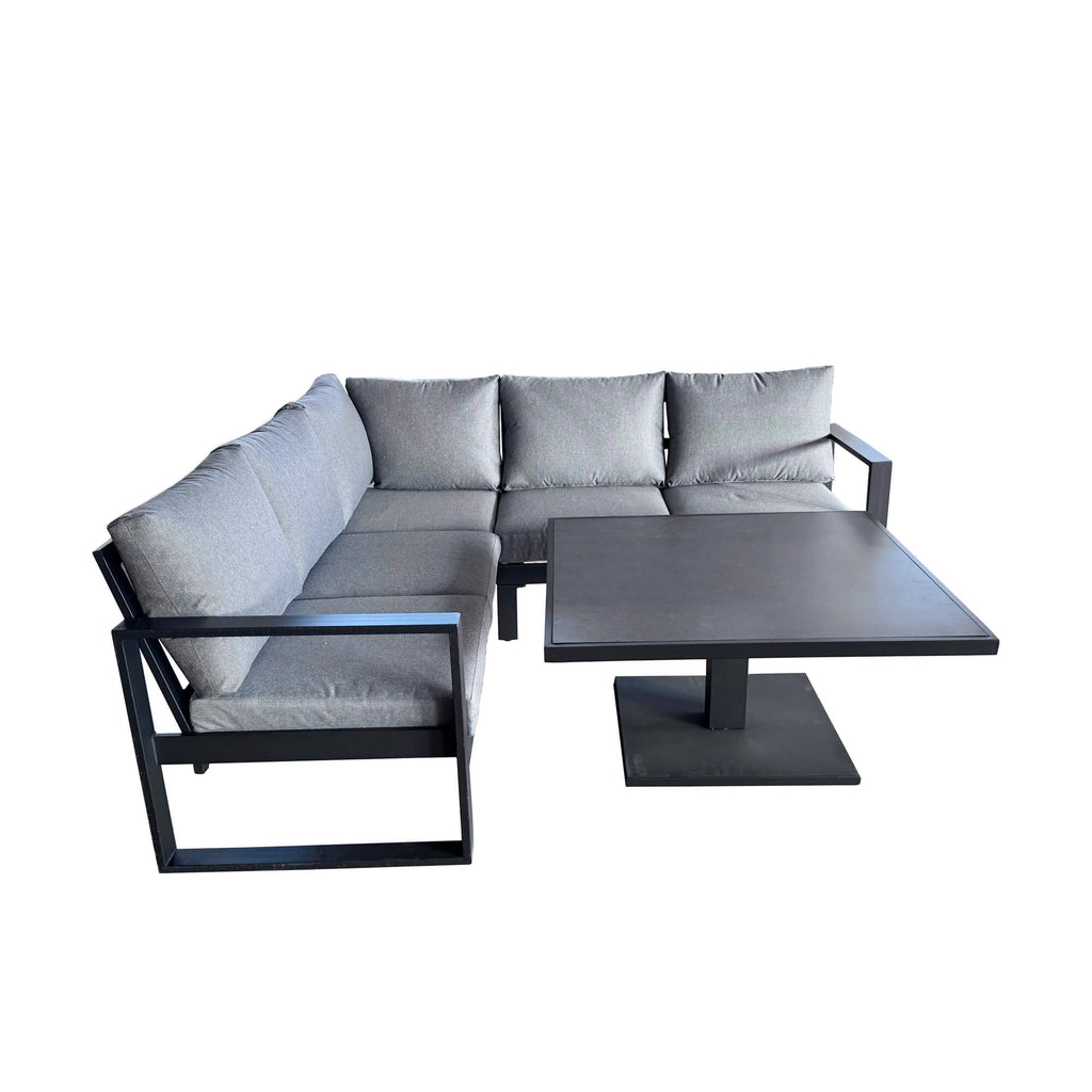 Side view of a Como dark grey outdoor corner set on a white background.