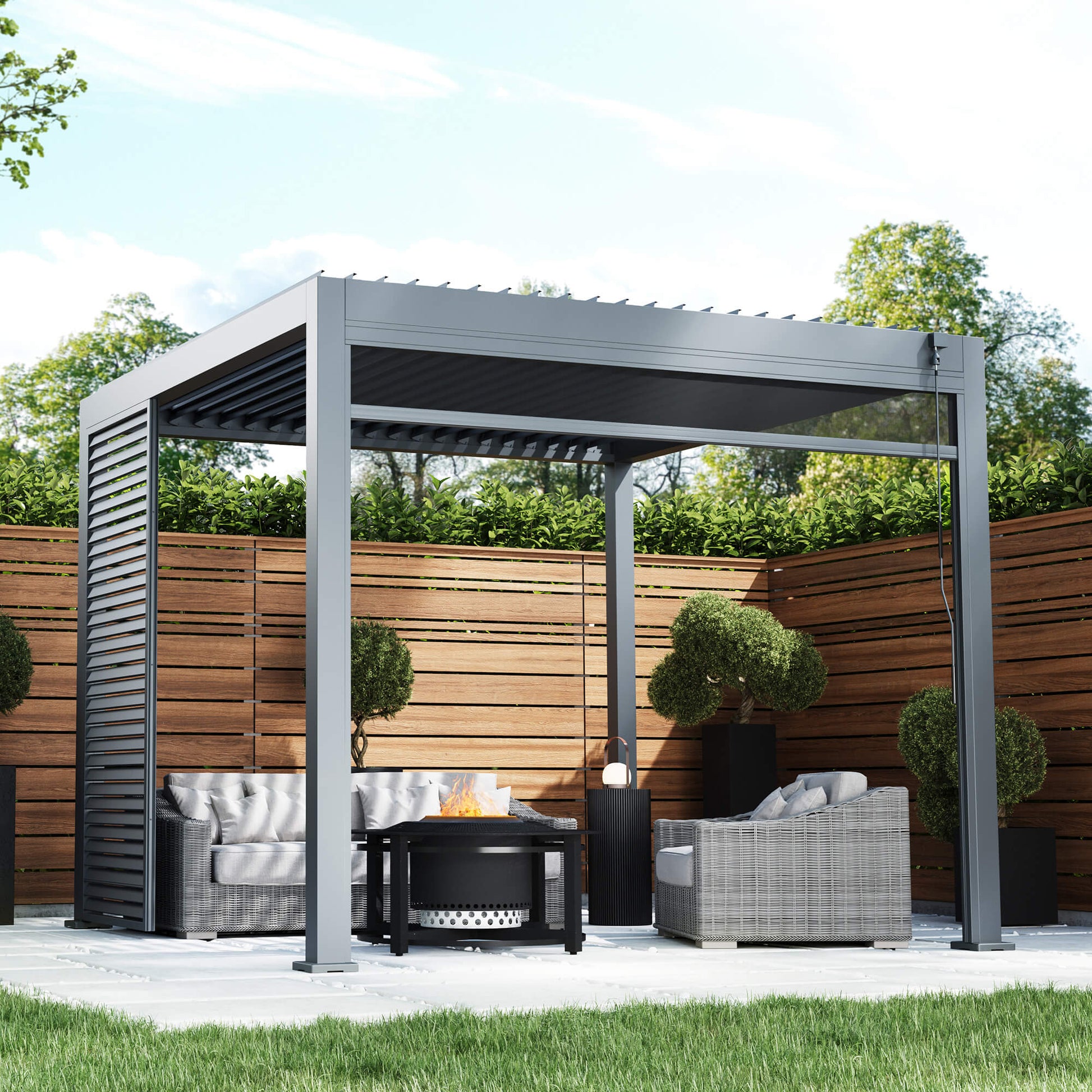A Riva 3x3m Aluminium Pergola, with outdoor furniture, and fire pit in an outdoor garden patio setting. 