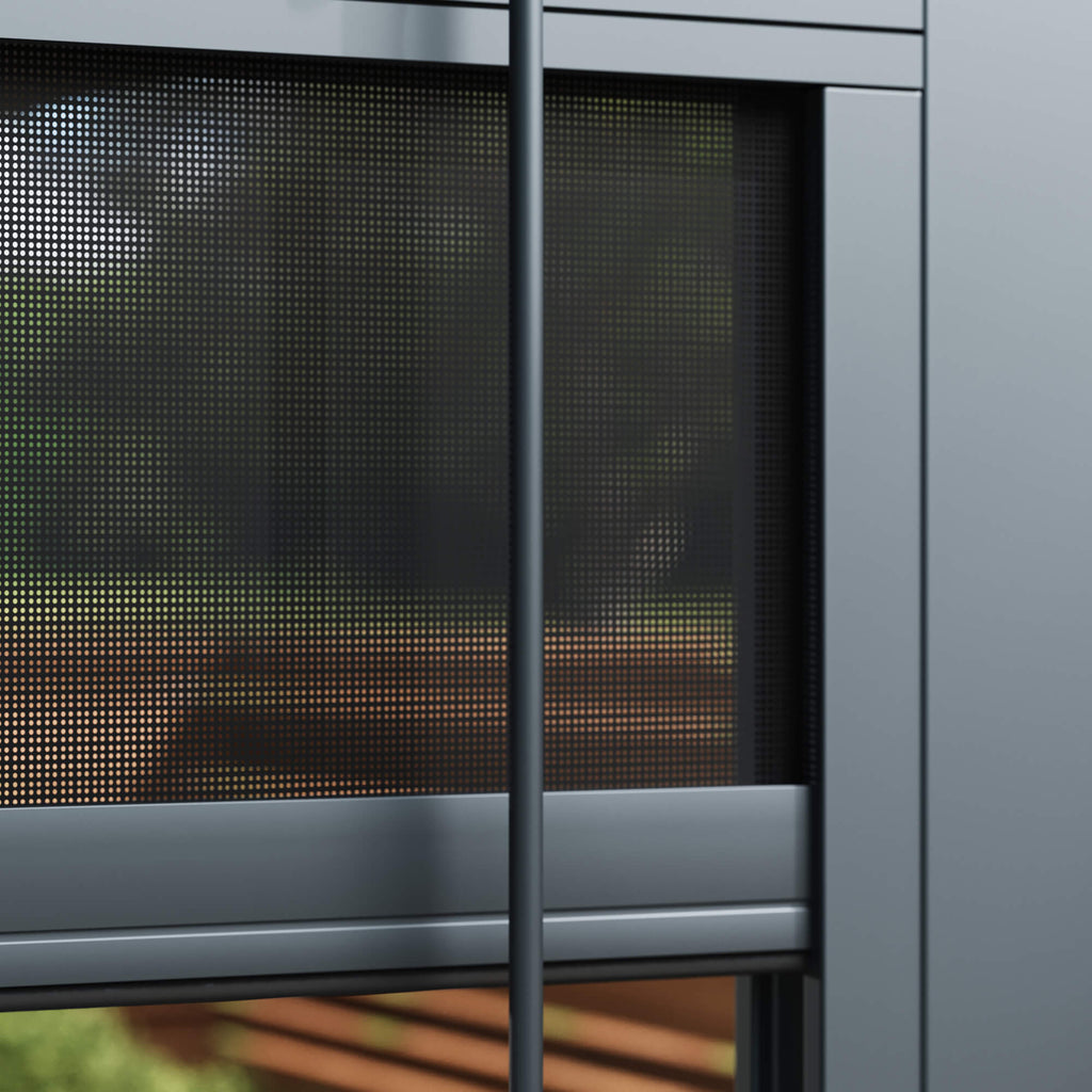 Close-up of a Riva windproof blind with a blurred garden background.