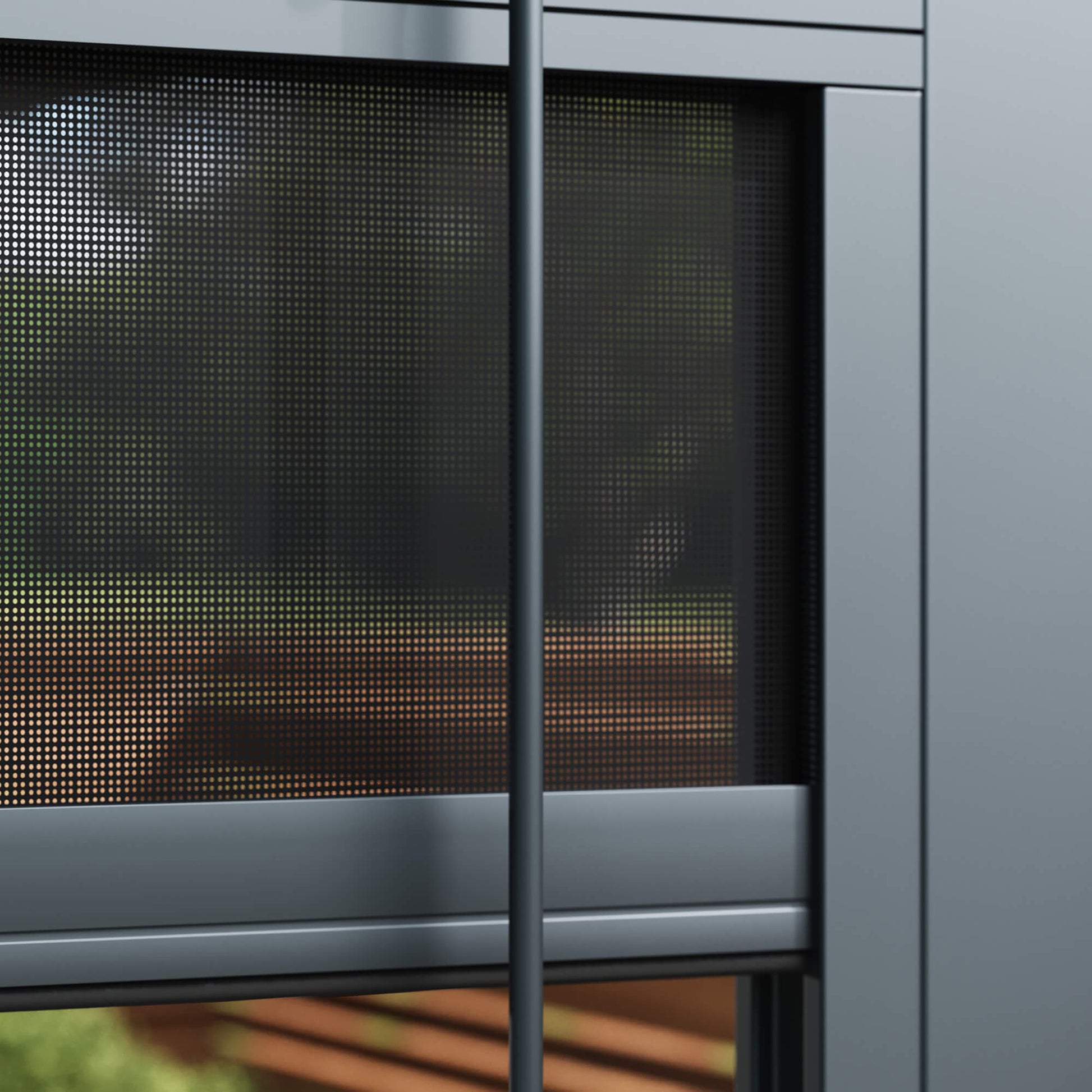 Close-up of a Riva windproof blind with a blurred garden background.
