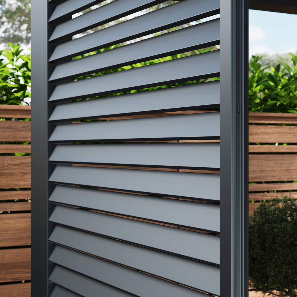 Close-up of a louvre wall panel on a Riva Deluxe Aluminium Pergola in a garden setting.